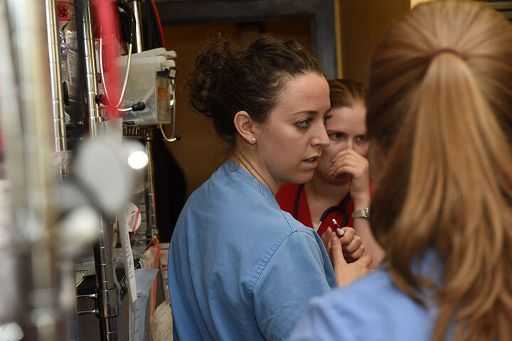 Three medical students in an outreach clinic.